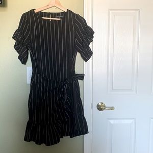 Black dress with white stripes. Ties at the waste, Very classy and  cute!